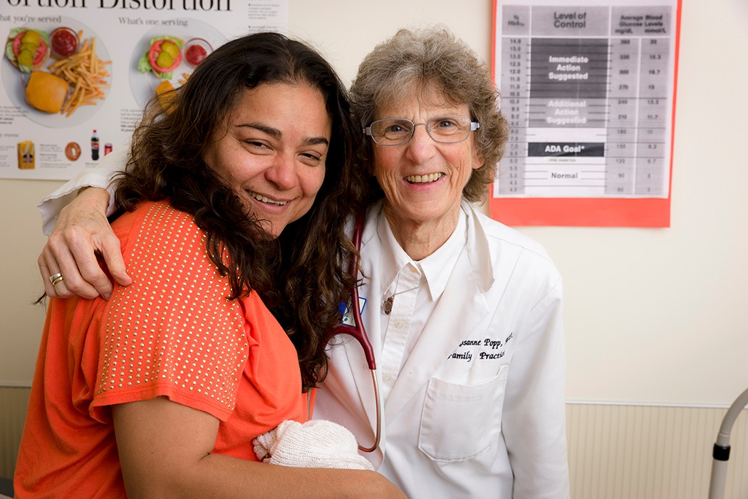 Sister Rosanne Popp, MD., with Patient at Christus Health Care St. Mary's Clinic, Houston, Texas