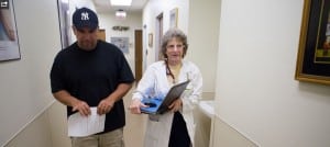 Sr. Rosanne Popp M.D. walks to the waiting room at CHRISTUS St. Marys Clinic to receive another patient