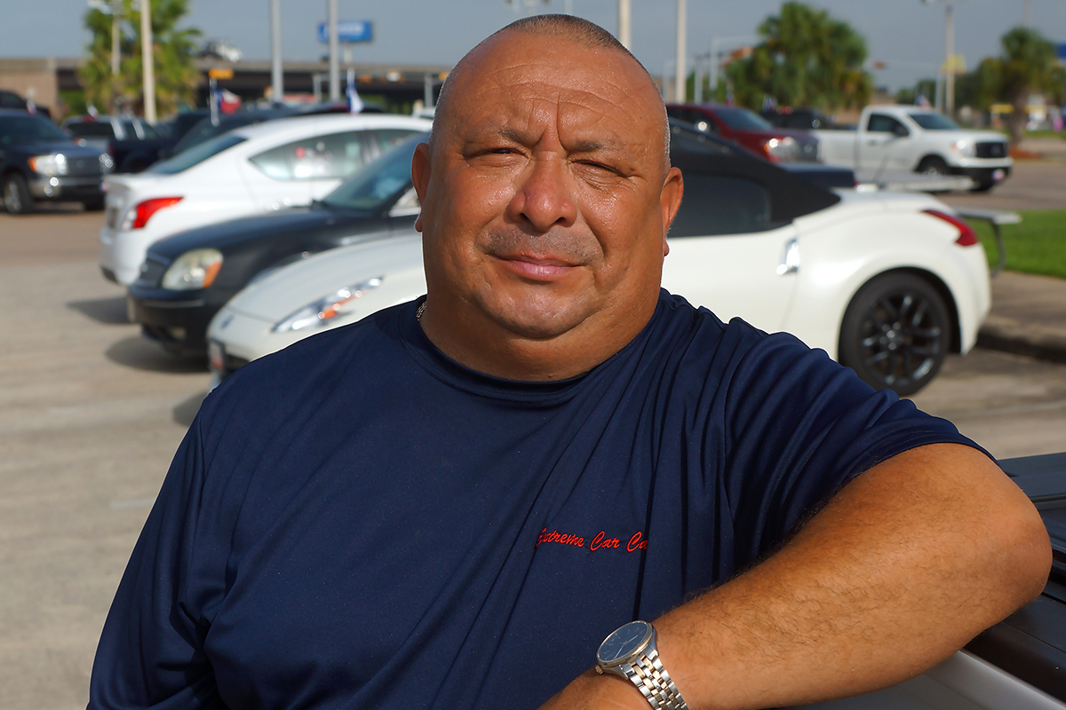 Steve Gonzalez on dealership parking lot that he helps service
